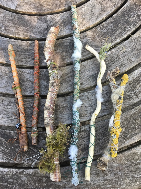 Journey Sticks by S. Holloway.
Six sticks wrapped in different coloured string, with lichen, sheeps wool and feathers.